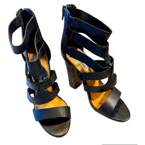 Steve Madden size 6.5 black, leather strapped shoe.